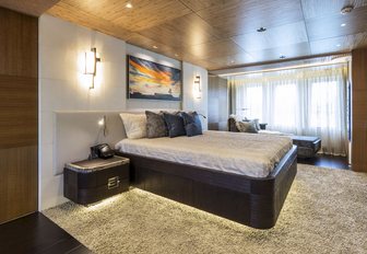 master suite with large bed and full-length windows on board luxury yacht RUYA 