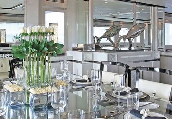 close-up of glass dining table in main salon of charter yacht ‘Sealyon 37’ 