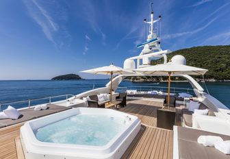 Jacuzzi and sun pads on sundeck of charter yacht FERDY 