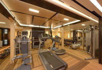 A treadmill and cross trainer in the gymnasium of superyacht AMARYLLIS