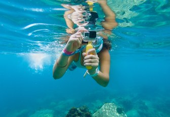 snorkeler takes a picture of the fascinating underwater world of Fiji