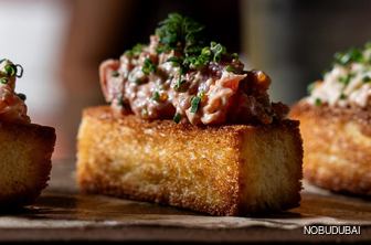 Silken tuna nestled within the cloud-like embrace of Japanese milk bread.