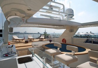 bar and dip pool with sun loungers beyond on the sundeck of luxury yacht TATIANA 