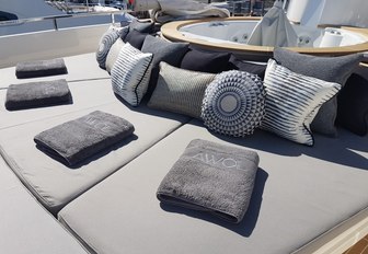 spa pool surrounded by sun pads on the sundeck of luxury yacht AWOL