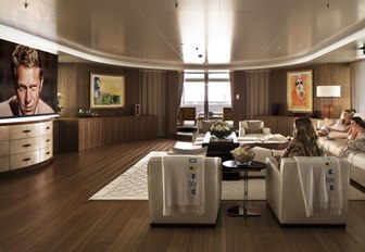 charter guests watch a movie on the wide-screen TV on board motor yacht Lady E 