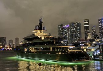 a superyacht illuminated by luxurious hull lights underway to the miami yacht show 2020