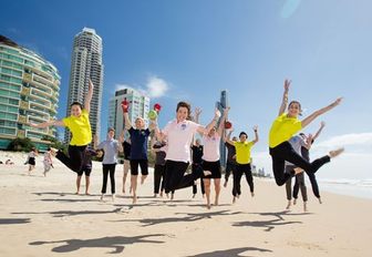athletes competing for Australia at Gold Coast 2018 pose for a photo on Gold Coast beach