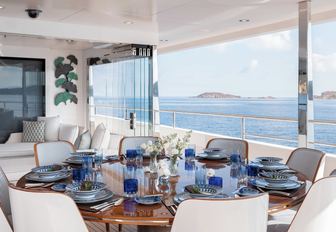 alfresco dining for eight on the upper deck aft of luxury yacht JOY