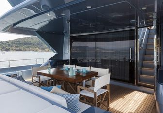 Covered outdoor dining area on superyacht 55 FIFTYFIVE