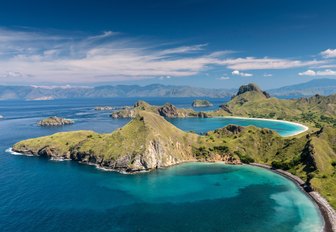 rugged landscape and blue waters of Flores island in Indonesia