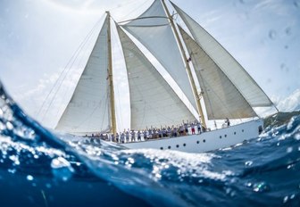 charter yacht CHRONOS cuts through the water during the Antigua Classic Yacht Regatta 