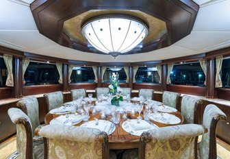 circular, formal dining area aboard luxury yacht STARSHIP  