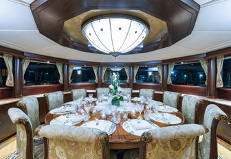 circular, formal dining area aboard luxury yacht STARSHIP  