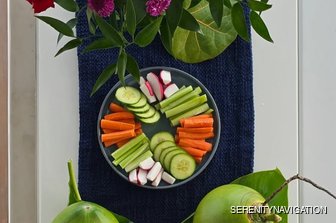 Vegetable arrangement with vibrant flowers