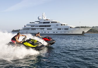 TITANIA anchors on a private yacht charter as guests try out the jet skis