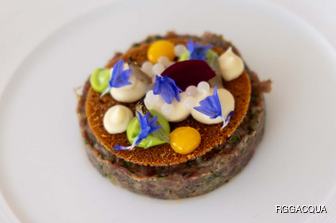 Superyacht cuisine with purple flowers arranged