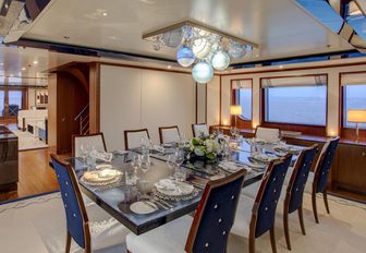 formal dining setup on board charter yacht CYNTHIA