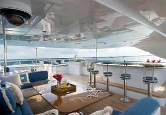 seating area and bar under the radar arch on the sundeck aboard luxury yacht Lady Joy 