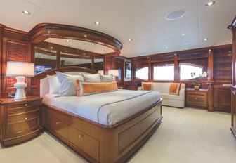 large bed in the master suite on board charter yacht Far From It 