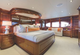 large bed in the master suite on board charter yacht Far From It 