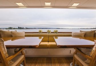 alfresco seating area on the main deck aft of motor yacht ‘Silver Lining’ 