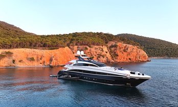 Charter yacht TALIA at anchor in a bay