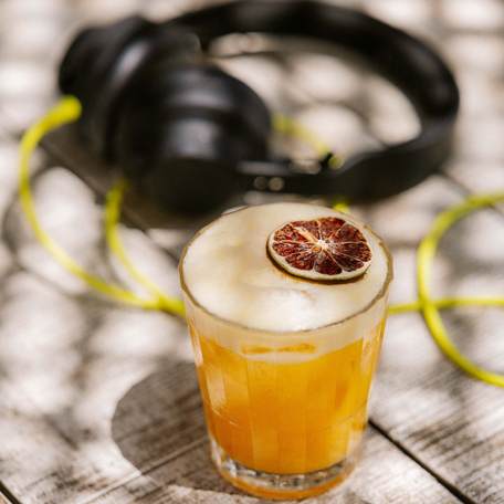 Shellona St Tropez cocktail and headphones