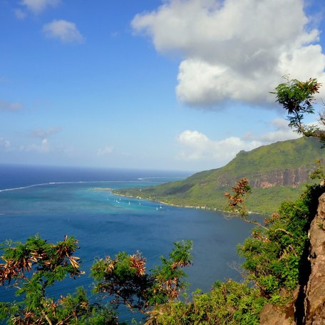 Overview of a cliff face and sea view on the island of Moorea, French Polynesia