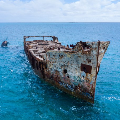A wreck dive projecting out of the water in the Bahamas