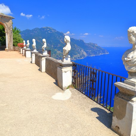 A line up of busts along a panoramic viewpoint in Italy