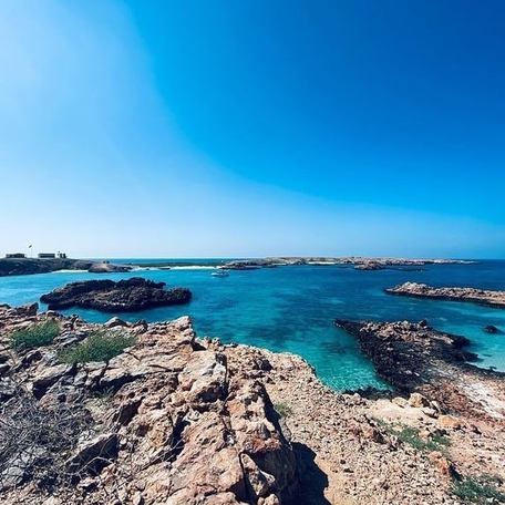 Rocky limestone lining the deep blue waters 