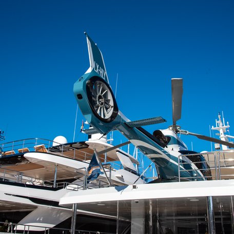 Aft view of a helicopter sitting on a superyacht at the Monaco Yacht Show