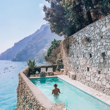 A swimming pool nestled into a cliff face along the Amalfi Coast