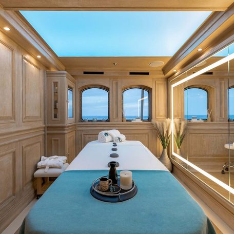 Massage room onboard Charter yacht NERO with large skylight above massage table