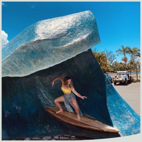 Tahiti - Tahiti Pearl Beach Resort person surfing