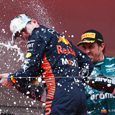 Formula One racers celebrate with spraying champagne