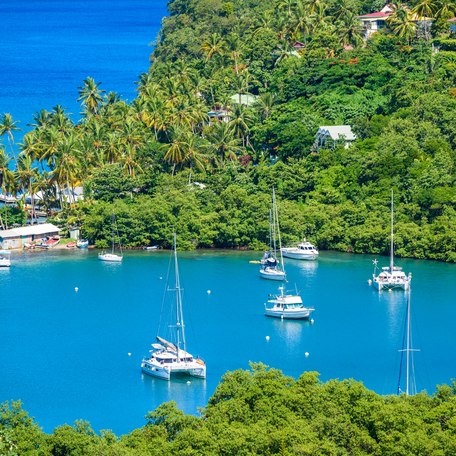 Marigot Bay, Saint Lucia, Caribbean. Tropical bay and beach in exotic and paradise landscape scenery. Marigot Bay is located on the west coast of the Caribbean island of St Lucia