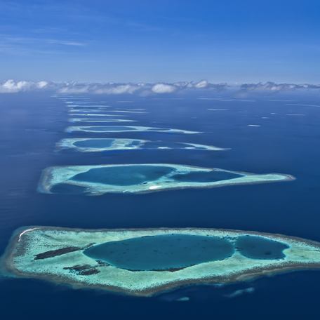 An aerial shot of the coral reef formations that make the Maldives.