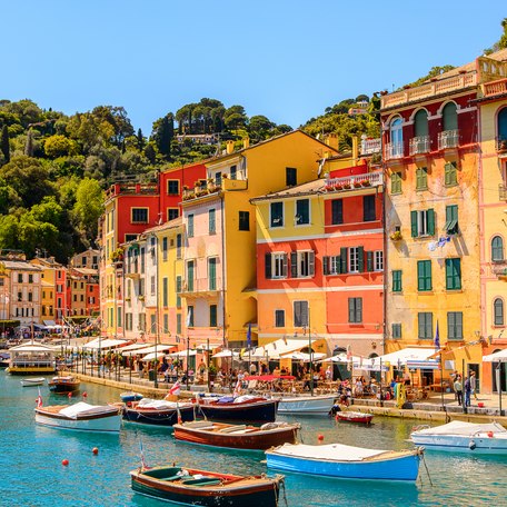 Row of colored buildings along the marina docks in Portofino