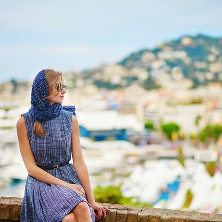 Young beautiful woman on Le Suquet hill in Cannes, France