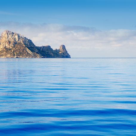A rock formation surrounded by sea, off the coast of Ibiza