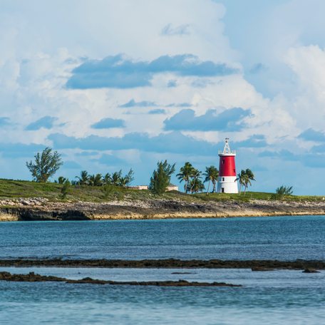 An overview of a coastline in the Bahamas with a lighthouse