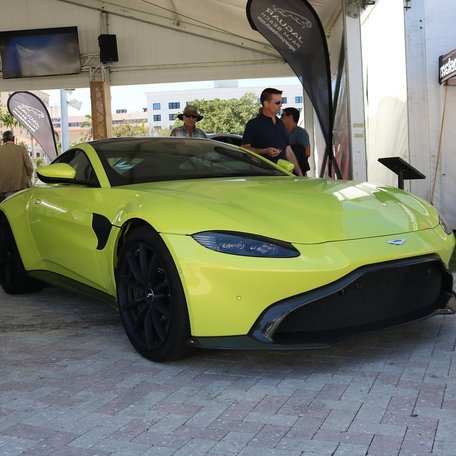 A yellow sports car at the Palm Beach International Boat Show