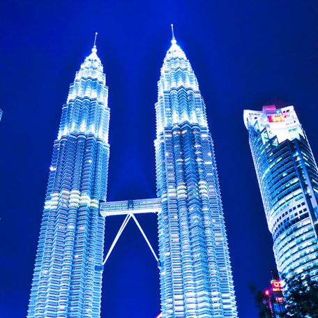 Tall illuminated skyscrapers in Malaysia at night