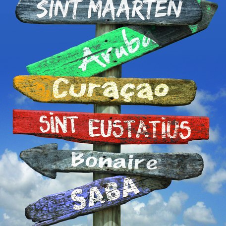 A signpost holding four signs pointing left and right