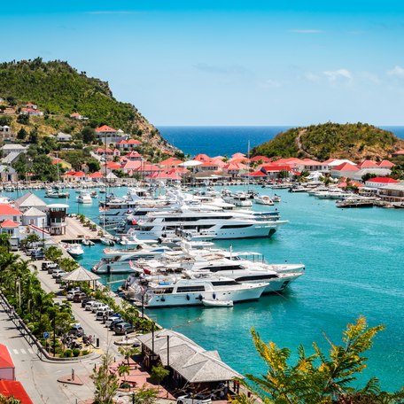 Overview of Gustavia Harbor with motor yachts berthed