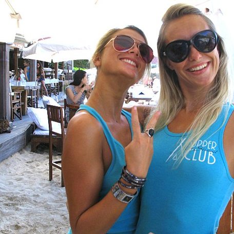 Two blonde women at a club in St Barts
