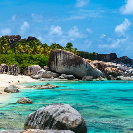 A deserted beach in the Virgin Islands with rock formations