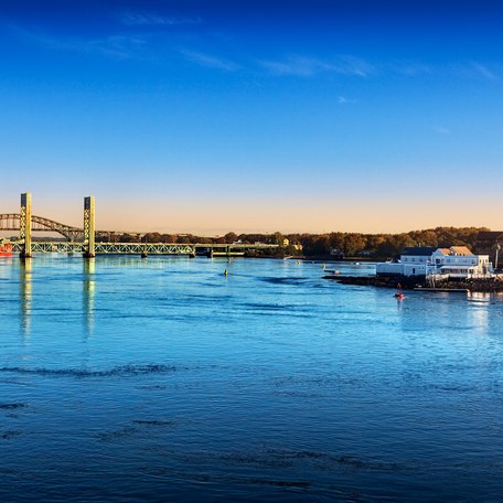 Water-level view of a small town on the coastline of New England