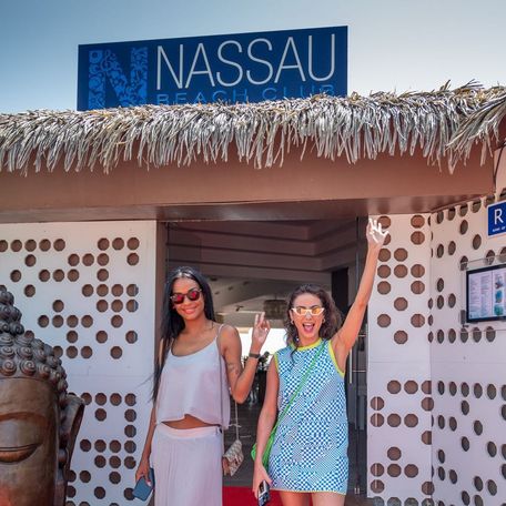 Two female charter guests in the doorway of Nassau Beach Club